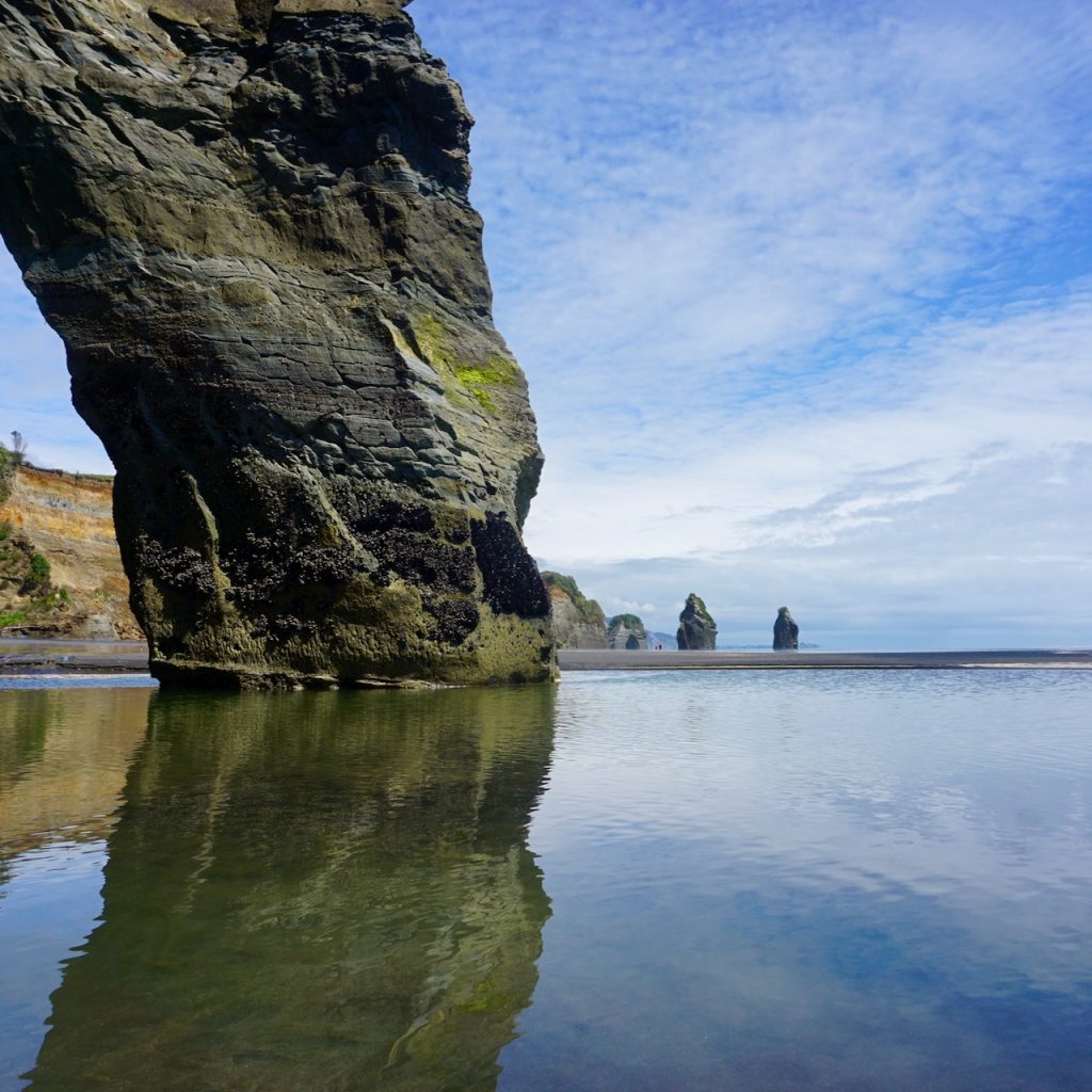 Rocks reflected in sea