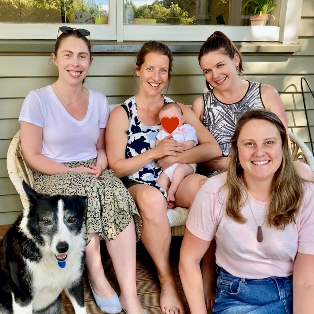 Women smiling, dog and baby