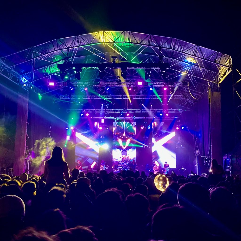Music festival with lights on big stage at night