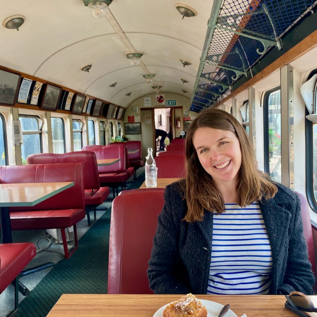 Woman sitting in railway carriage cafe